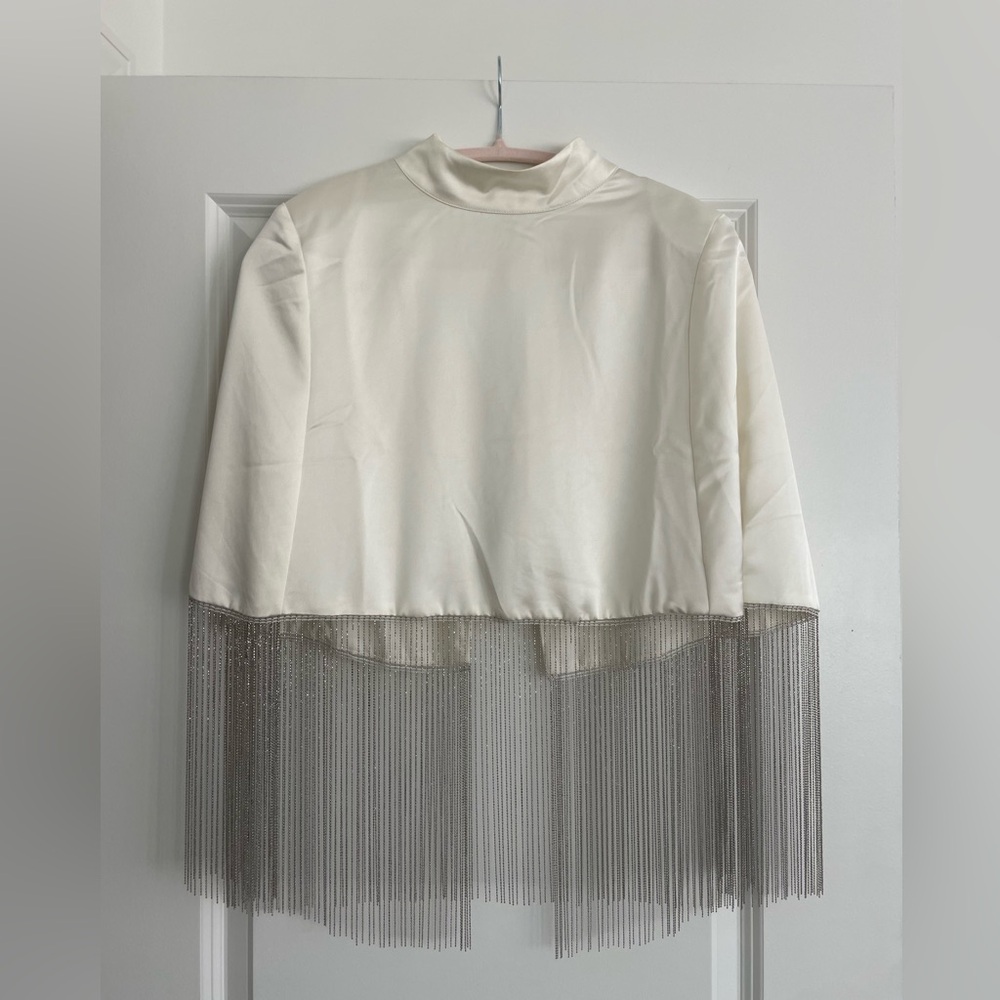Creamy white cape with silver beads